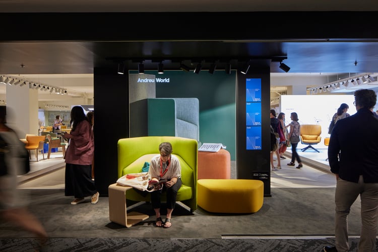 Attendee sitting on a lounge chair at NeoCon (Photo courtesy of NeoCon)