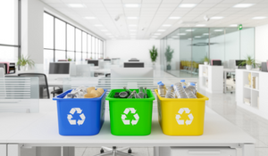 Recycling bins on a white desk in office space - Stock Image